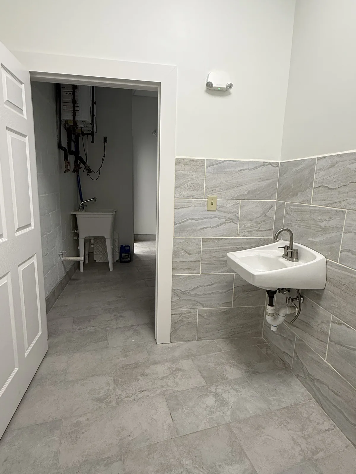 Utility sink alcove off the second restroom